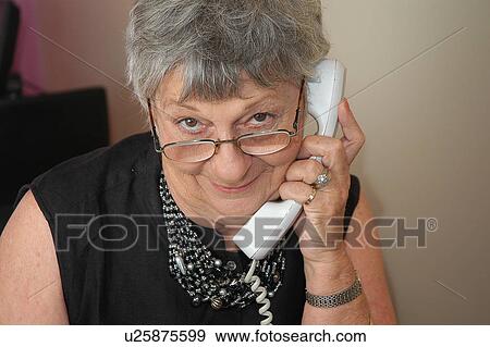 Stock Photo - Elderly woman on the telephone. Fotosearch