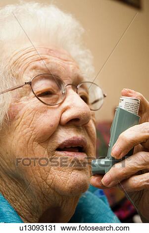 Stock Image - Elderly woman with Asthma. Fotosearch