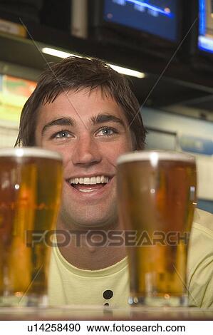 Stock Image - Enjoying a beer. Fotosearch