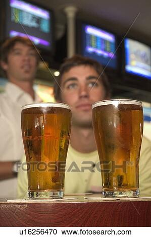 Stock Image - Enjoying beer. Fotosearch