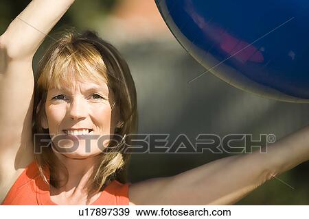 Stock Photo - Exercising ball. Fotosearch