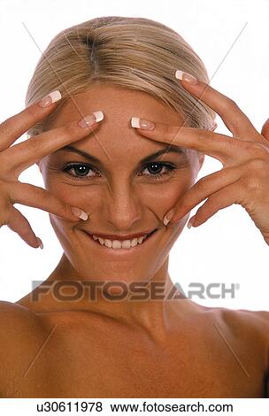 Stock Photo - Face with nails over it. Fotosearch