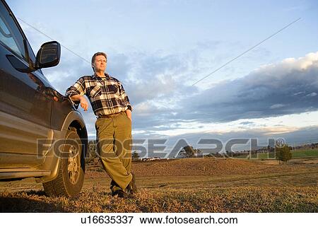 Farmer and his truck View Large Photo Image Stock Photo - Farmer and his truck. Fotosearch