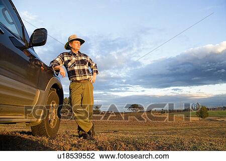 Stock Image - Farmer with a truck. Fotosearch