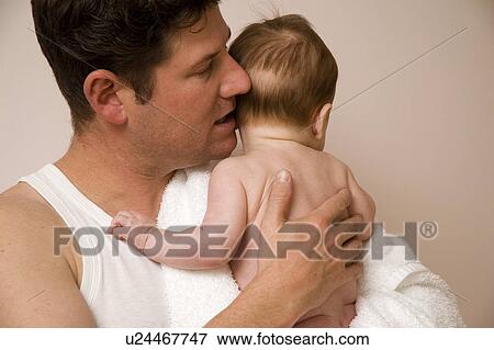 Stock Photo - Father holding his son. Fotosearch