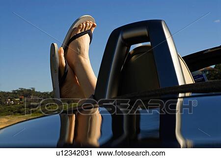 Feet outside the car View Large Photo Image Stock Image - Feet outside the car. Fotosearch