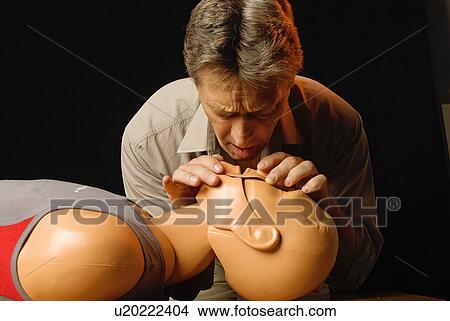 Picture - First aid practice CPR. Fotosearch