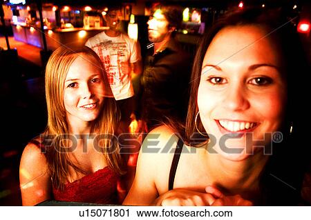 Friends at nightclub View Large Photo Image Stock Image - Friends at nightclub. Fotosearch