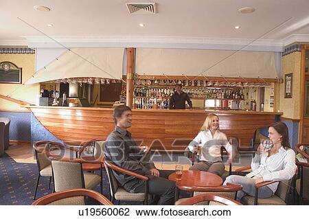 Stock Image - Friends at the pub. Fotosearch