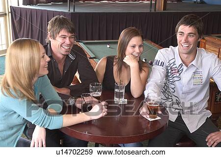 Stock Photo - Friends at the pub. Fotosearch
