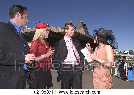 Stock Image - Friends at the races. Fotosearch