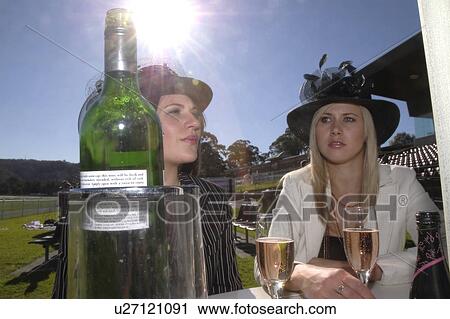 Stock Image - Friends at the races. Fotosearch