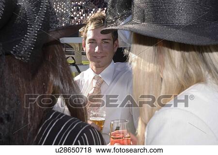 Stock Photo - Friends at the races. Fotosearch