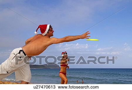 Stock Image - Frisbee play on Christmas day. Fotosearch