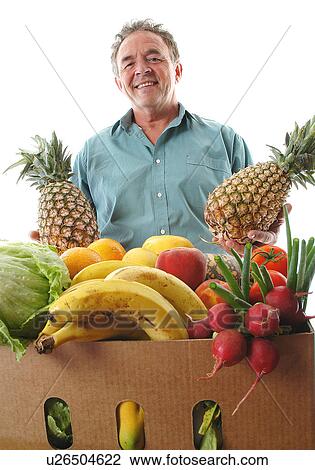 Stock Image - Fruit shop owner. Fotosearch