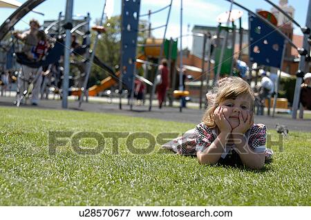 Girl at the playground View Large Photo Image Stock Photo - Girl at the playground. Fotosearch