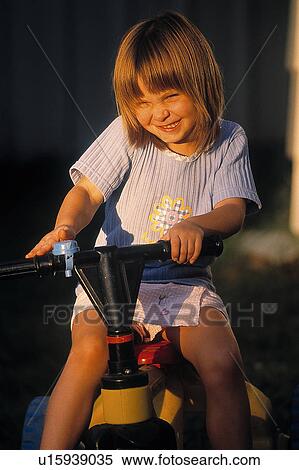 Stock Photography - Girl on bike. Fotosearch