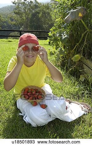 Girl with strawberry eyes outdoors View Large Photo Image Stock Image - Girl with strawberry eyes outdoors. Fotosearch