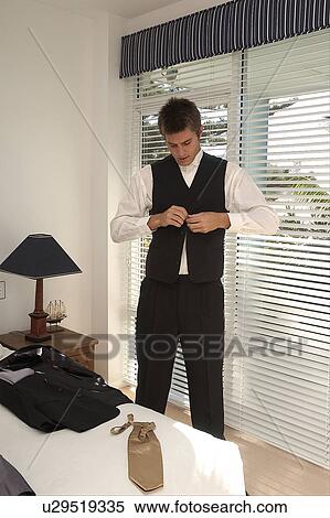 Stock Photography - Groom getting ready. Fotosearch