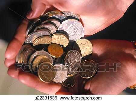 Stock Photograph - Handful of coins. Fotosearch