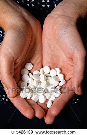 Stock Photo - Handful of pills. Fotosearch