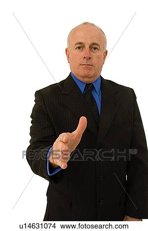 Handshake by a businessman View Large Photo Image Picture - Handshake by a businessman. Fotosearch