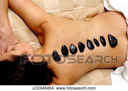 Picture - Hot rock massage. Fotosearch