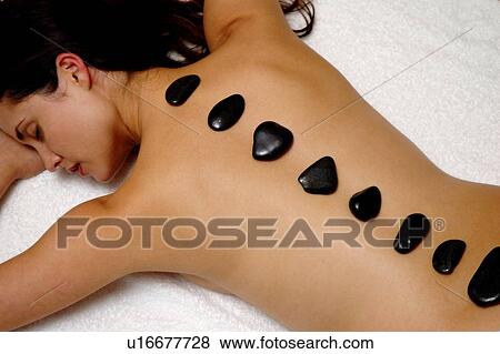 Hot rock massage View Large Photo Image Stock Photo - Hot rock massage. Fotosearch