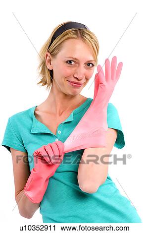 Stock Image - Housewife with rubber gloves. Fotosearch