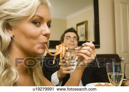Stock Image - Hungry woman. Fotosearch