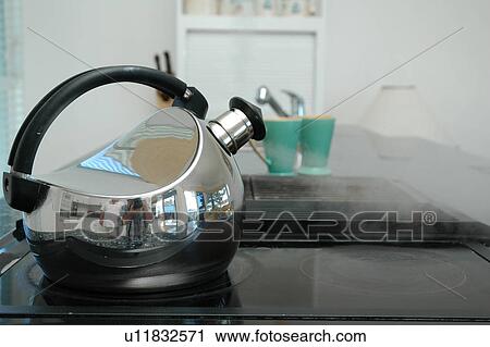 Stock Image - Kettle in the kitchen. Fotosearch
