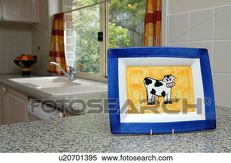 Stock Photography - Kitchen with a cow plate. Fotosearch