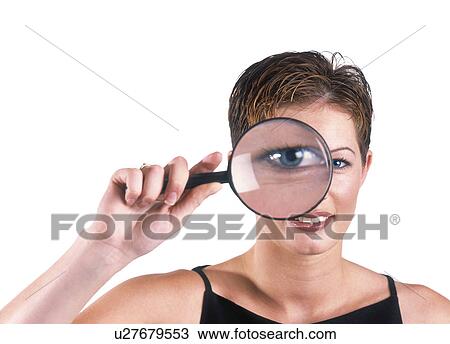 Stock Image - Magnified eye of a woman. Fotosearch