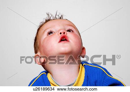 Male toddler looking up View Large Photo Image Picture - Male toddler looking up. Fotosearch