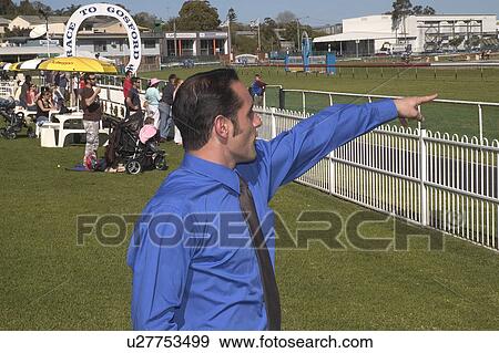 Stock Photo - Man cheering his horse. Fotosearch
