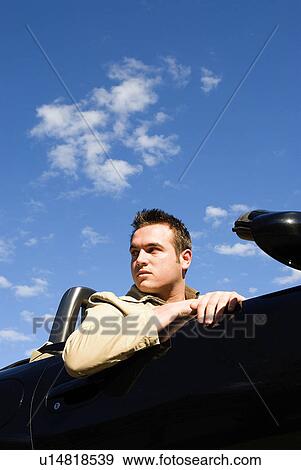 Stock Photo - Man in convertible. Fotosearch