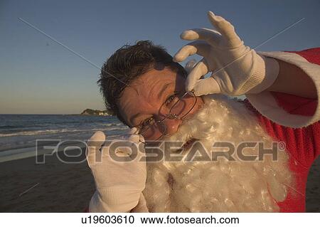 Stock Image - Man in Santa costume. Fotosearch