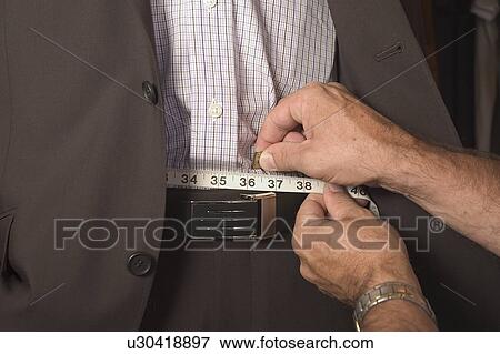 Measuring the waist View Large Photo Image Stock Photo - Measuring the waist. Fotosearch