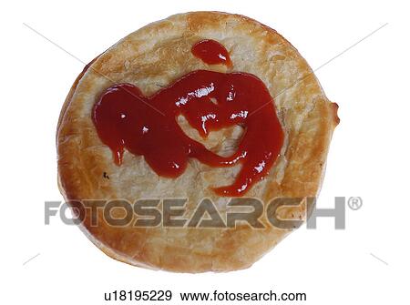 Stock Photo - Meat pie with sauce. Fotosearch