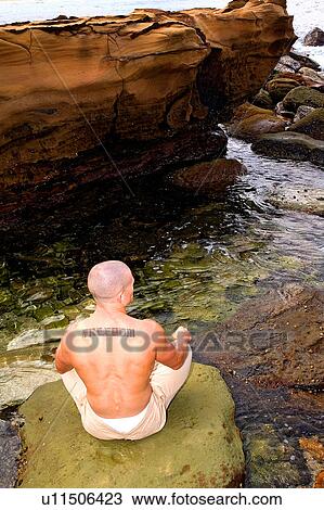 Meditating by the ocean View Large Photo Image Stock Image - Meditating by the ocean. Fotosearch