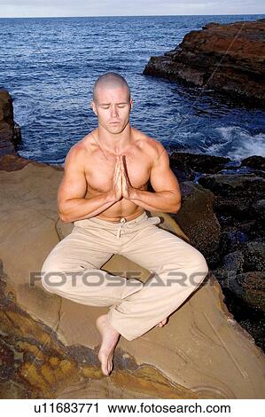 Meditating by the ocean View Large Photo Image Stock Image - Meditating by the ocean. Fotosearch