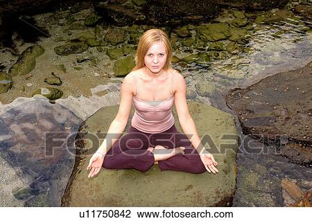 Meditating by the ocean View Large Photo Image Stock Image - Meditating by the ocean. Fotosearch