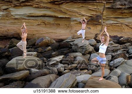 Stock Photo - Meditating on the rocks. Fotosearch