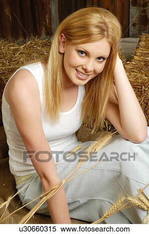 Stock Photography - Model in a barn. Fotosearch