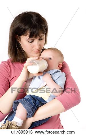 Mother feeding baby View Large Photo Image Stock Image - Mother feeding baby. Fotosearch