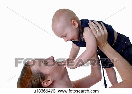 Mother playing with her baby View Large Photo Image Stock Image - Mother playing with her baby. Fotosearch