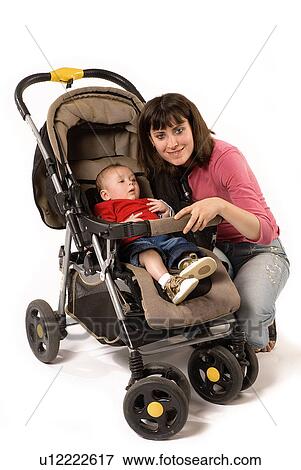 Stock Photo - Mother with baby in a stroller. Fotosearch
