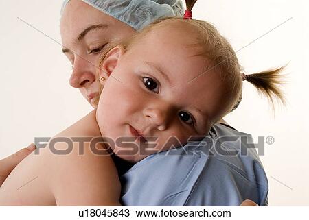 Nurse with baby View Large Photo Image Stock Image - Nurse with baby. Fotosearch