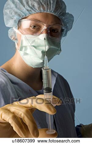 Nurse with syringe View Large Photo Image Stock Photo - Nurse with syringe. Fotosearch