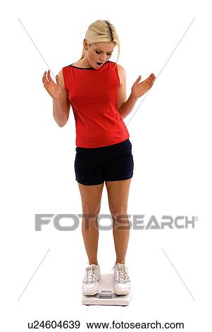 Stock Photo - On the scales. Fotosearch